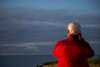 Person watching bird migration by the coast near Vedersø Strand Camping.
