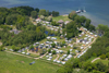 Aerial photo of Svendborg Sund Camping with tents, caravans, and a view of the water.